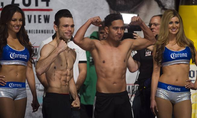 Lightweights Ricardo Alvarez and Sergio Thompson, both of Mexico, pose off for fans following their weigh-ins at the MGM Grand Arena on Friday, March 07, 2014.